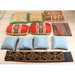 Ten different antique silk and woven cushions with floral and religious decors. About 1900.