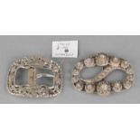 Two silver buckles, 833/000, 1 oval model decorated with buttons, running in size, 8,5x6,5cm and an