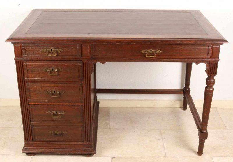Antique German Oak Wood Gründerzeit writing desk with six drawers. About 1900. Recently
