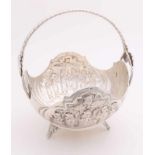 Silver bonbon basket, 800/000. Round model with battery-shaped edge placed on 3 floral legs. The