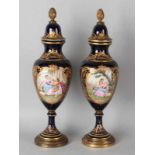 Two antique French handpainted porcelain vases with figures in landscapes decors (romantic).