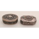 Two silver pillos, 800/000, an oval box with flowerwork on the hinged lid, with a floral border