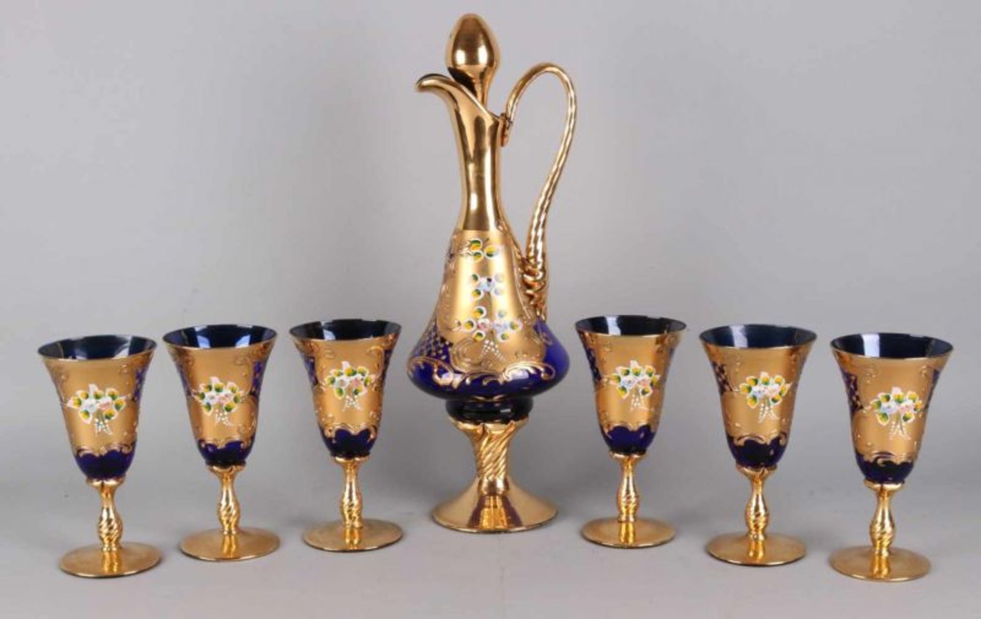 Old glassware with leaf gold and floral enamel decors, 20th century. The dishes consist of a