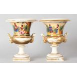 Two porcelain empire amphora vases with figures in landscape and gold decor. 19th century. One vase