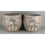 Two large Chinese porcelain flower pots with interior carp decor and exterior floral enamel decor