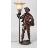 Composition metal table lamp 'Man at lantern'. First half 20th century. Size: 55 cm.In good