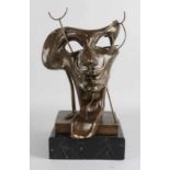 Bronze figure on black marble basement. Mask to Salvador Dali. Signed Dali. Dimension: 40 cm. In