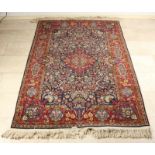 Old-knitted Persian Kaschan garment with multicolored floral decors. Dimensions: 124 x 190 cm. In