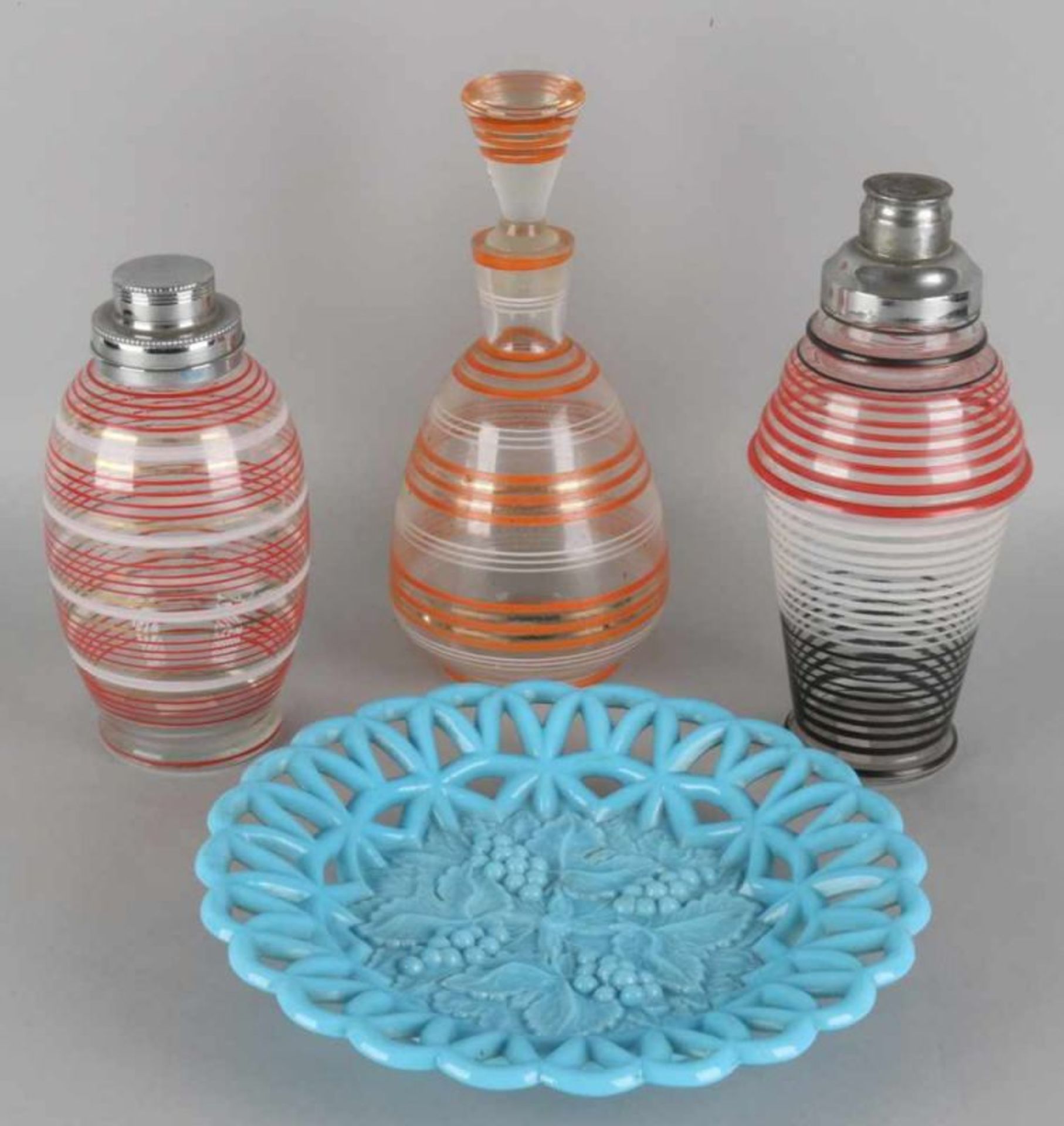 Four times Art Deco glassware, circa 1930. Two times cocktail shakers, one carafe, one blue-glass