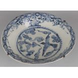 Very large Chinese porcelain deep dish (dish) with blue floral and bird decor. 17th century.