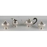 Special silver teaservies, 833/000, with a teapot, sealing tea, sugarcane and milk can. Oval model