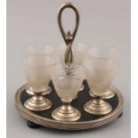Liqueur glasses set on holder with silver, 835/000. Around wooden tabletop with wooden bow legs,