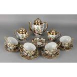 Antique Japanese porcelain dinnerware with landscapes, figures and gold decorations. About: 1920.