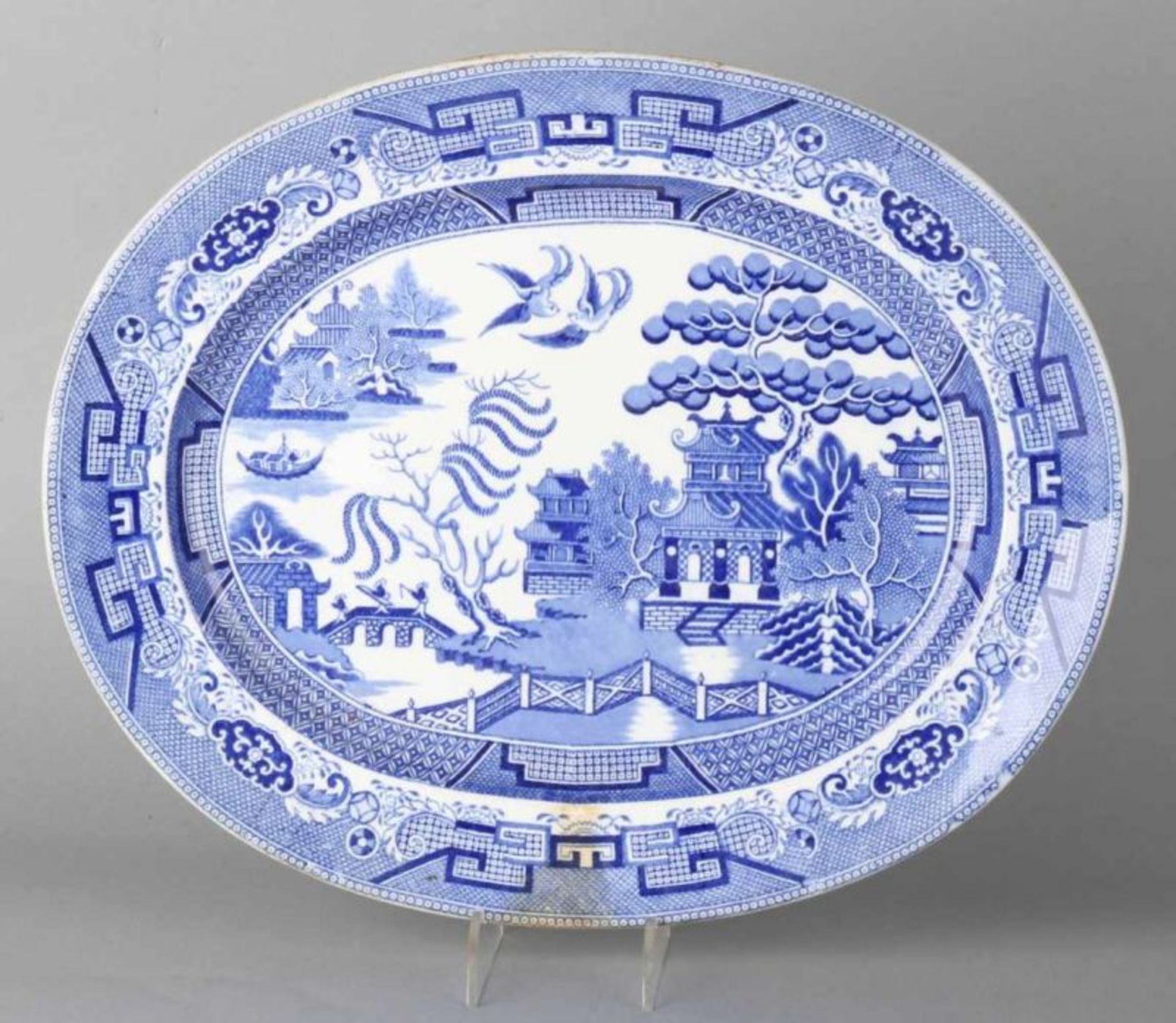 Large antique English ceramic meat dish with chinoiserie decor. One chip. About: 1900. Dimensions: