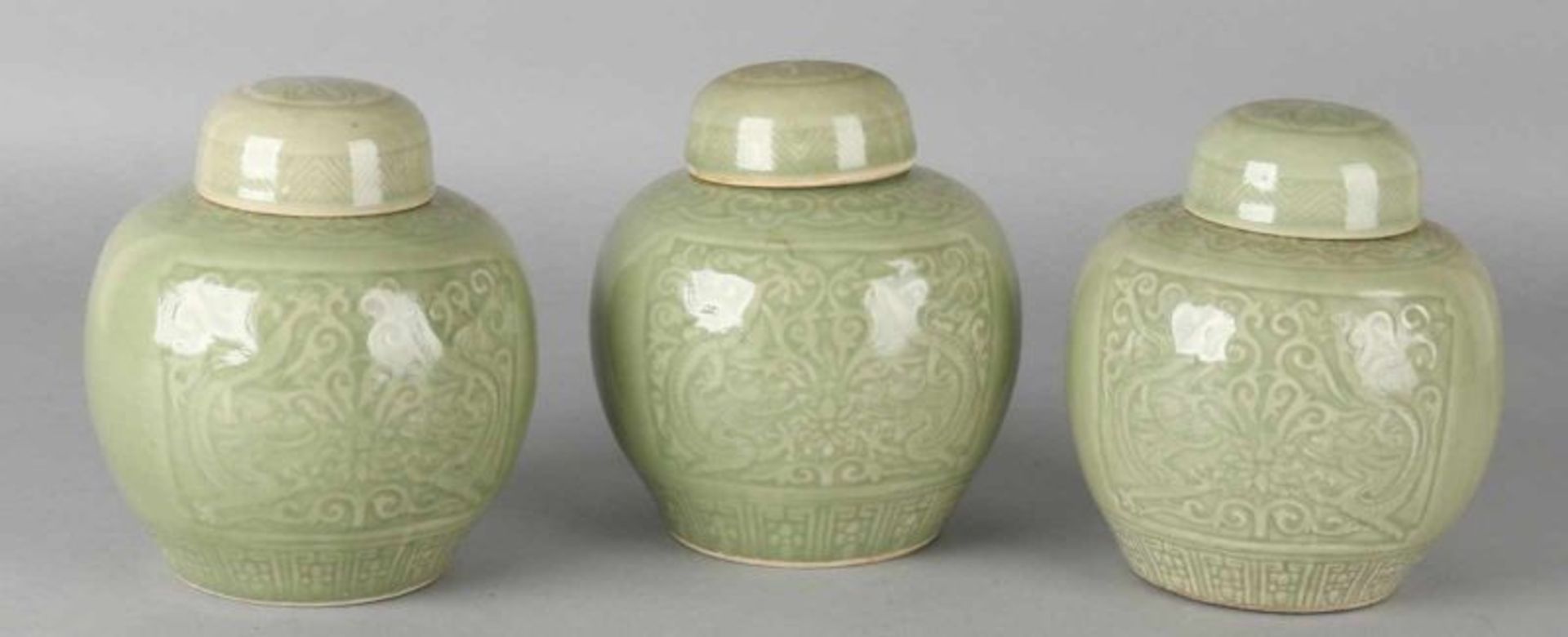Three old Chinese celadon porcelain processed ginger pots. 20th century. Dimensions: 15 x 12.5 cm ø.