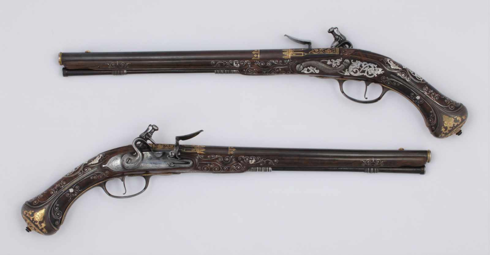 A pair of flintlock pistols La Marre A VIENNE Datace: circa 1680 An important and rare pair of