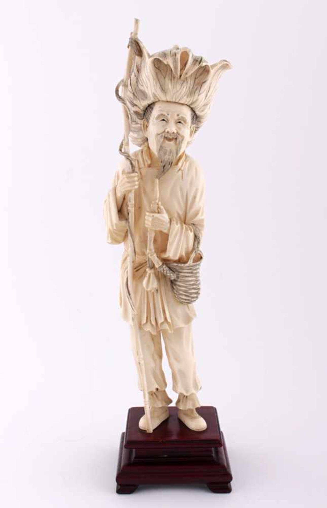 Chinese ivory fisherman statue China, early 20th century, ivory, a fisherman in a wide hat holding a