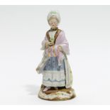 DAME MIT MUFF. Meissen. Porzellan, farbig staffiert. H.20 cm. Schwertermarke. Zustand B.