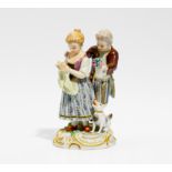 KINDERPAAR MIT HUND. Meissen. Vor 1924. Modell A. Ringler. Porzellan, farbig und gold staffiert. H.