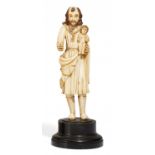 HEILIGER JOSEF. 19.Jh. Elfenbein geschnitzt. Ebonisierter Holzsockel. Standfigur mit Christuskind