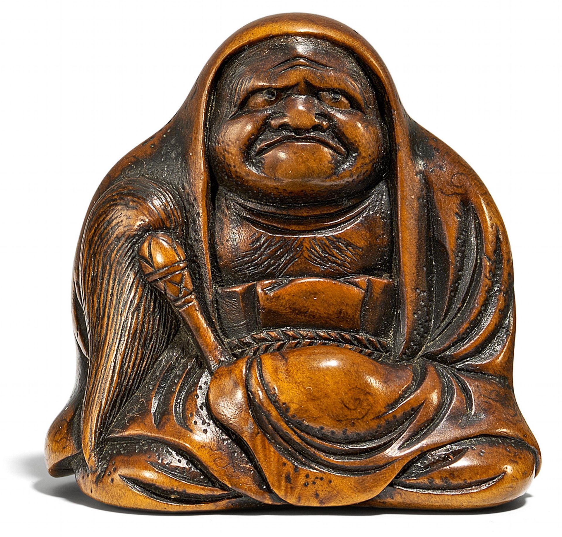 NETSUKE: MEDITIERENDER DARUMA. Japan. Edo-Zeit. Ca. 1820-1860. Eichenholz, die Pupillen eingelegt