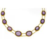 AMETHYST-PERL-COLLIER. Wohl Frankreich, um 1880. 750/- Gelbgold, L.ca. 42,0cm. 16 oval/ rund