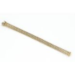 gouden armband platte en opengewerkte 14 krt. gouden armband, lengte: 19 cm., breed: 11 mm.,