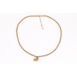 gouden collier met hanger 22 krt. gouden collier met gouden hanger in de vorm van zeemonster,