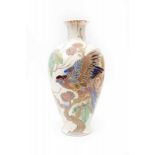 Plateelbakkerij Zuid Holland, Gouda A monumental matt white glazed ceramic vase with multicolour