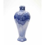 Distel Amsterdam A blue glazed ceramic vase with floral relief pattern, with square top rim, circa