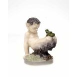 Royal Copenhagen A glazed porcelain figure of a faun with frog, designed by Christian Thomsen,