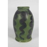 Gebr. Andrée Apeldoorn A green glazed ceramic vase decorated with vertical black wavy lines, circa