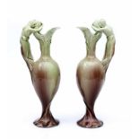 Jugendstil A pair of brown/green glazed ceramic jugs with handles shaped as female figures, both