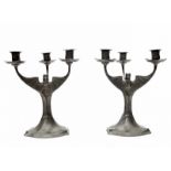 Hugo Leven (1874-1956) A pair of pewter three-light candelabra decorated with bats, model no.