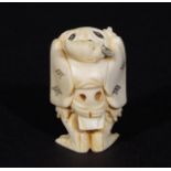 Ivory netsuke, Man with toad, signed, l. 5 cm. 27.00 % buyer's premium on the hammer price, VAT