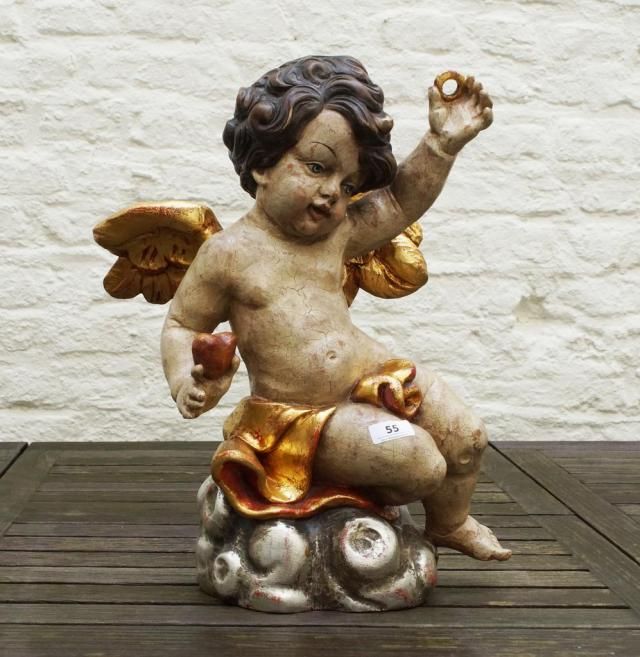 Polychrome and partly gilt putto, 20th century, h. 40 cm. 27.00 % buyer's premium on the hammer