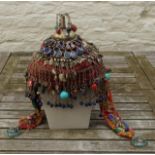 Eastern hat, set with metal, lapis lazuli and coloured coral 27.00 % buyer's premium on the hammer