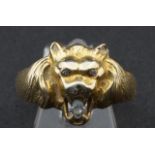 Yellow gold ring with lion's head, 14 krt, set with three diamonds, ring size 17 1/4, appr. 7.3