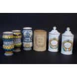 6 apothecary pots: 2 porcelain, early 20th century, one lid with chip, h. 27 cm + Earthenware pot,