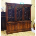 English mahogany veneered library, 20th century, with three glass doors, four shelves, three doors,