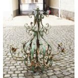 Green painted iron chandelier for candles, 19th/20th century, h. 98 cm. 27.00 % buyer's premium on