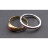 White gold ring, 18 krt., set with ruby, ring size 17 3/4 + Yellow gold ring, 14 krt, set with