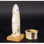 African ivory head on wooden base, h. 19,5 cm + Ivory bracelet, diam. 8 cm (2x) 27.00 % buyer's
