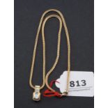 Yellow gold necklace, 14 krt., l. 38 cm + Yellow gold pendant, 18 krt., set with baguette cut