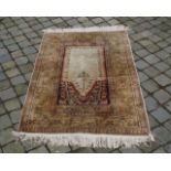 Silk carpet, dim. 133 x 88 cm, wear and tear 27.00 % buyer's premium on the hammer price, VAT