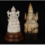 2 Indian Ganesha's, one made of bone and one made of plastic, on wooden base, h. 6 and 7 cm (2x)