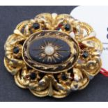 Antique gilt silver brooch, set with onyx and seed pearl, l. 3 cm. 27.00 % buyer's premium on the