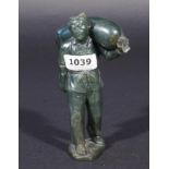 Chinese soapstone man with bag, on wooden base, h. 13,5 cm, slightly damaged 27.00 % buyer's
