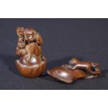 Boxwood netsuke, monkey on dolphin, signed, l. 6 cm + Boxwood monkey with scepter, signed, l. 5