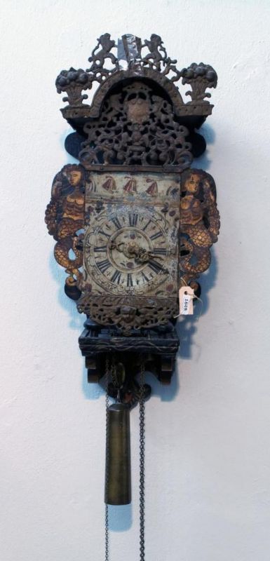 Wallclock, 18th century, Roman numerals, with painted dial, dim. 63 x 35 cm, damaged, wear and tear